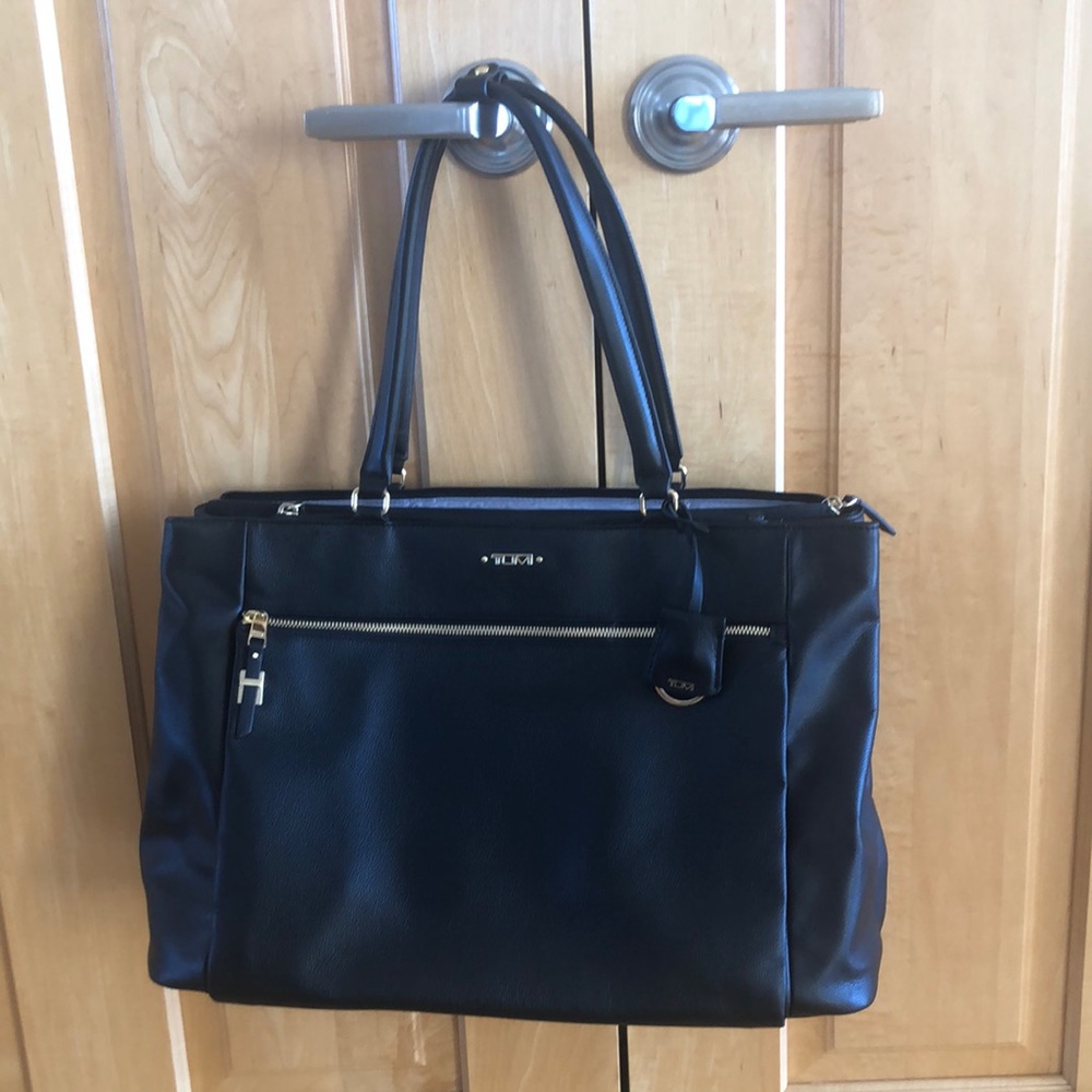 Tumi black leather voyager